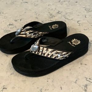 Yellow Box zebra rhinestone flip flops, size 9.